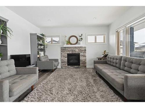 2 Meadow Close, Lacombe, AB - Indoor Photo Showing Living Room With Fireplace