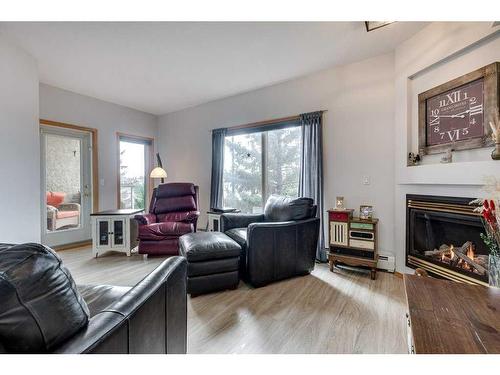 304-5300 48 Street, Red Deer, AB - Indoor Photo Showing Living Room With Fireplace