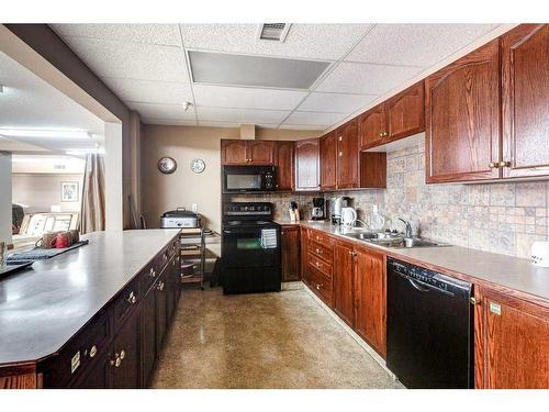304-5300 48 Street, Red Deer, AB - Indoor Photo Showing Kitchen With Double Sink