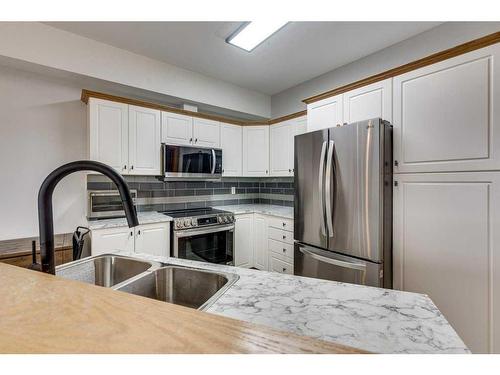 304-5300 48 Street, Red Deer, AB - Indoor Photo Showing Kitchen With Double Sink With Upgraded Kitchen