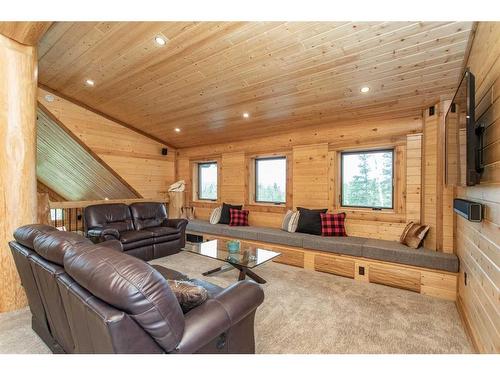 34226 Range Road 43, Rural Mountain View County, AB - Indoor Photo Showing Living Room With Fireplace