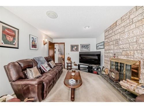 5408 60 Street, Ponoka, AB - Indoor Photo Showing Living Room With Fireplace