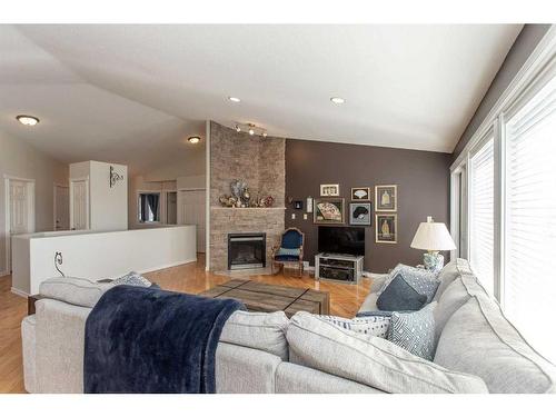 2 Estella Crescent, Lacombe, AB - Indoor Photo Showing Living Room With Fireplace