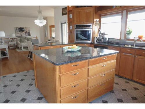 18 59515 Rge Rd 260, Westlock, AB - Indoor Photo Showing Kitchen With Fireplace With Double Sink