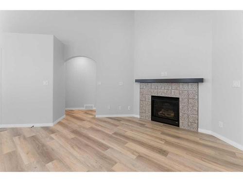28 Vincent Close, Red Deer, AB - Indoor Photo Showing Living Room With Fireplace