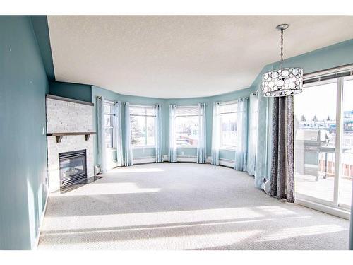 102-5435 Lakeshore Drive, Sylvan Lake, AB - Indoor With Fireplace