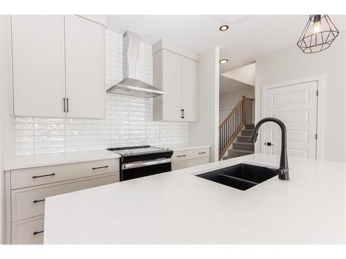 21 Toal Close, Red Deer, AB - Indoor Photo Showing Kitchen With Double Sink With Upgraded Kitchen