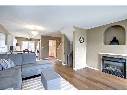 1602-5220 50A Avenue, Sylvan Lake, AB - Indoor Photo Showing Living Room With Fireplace