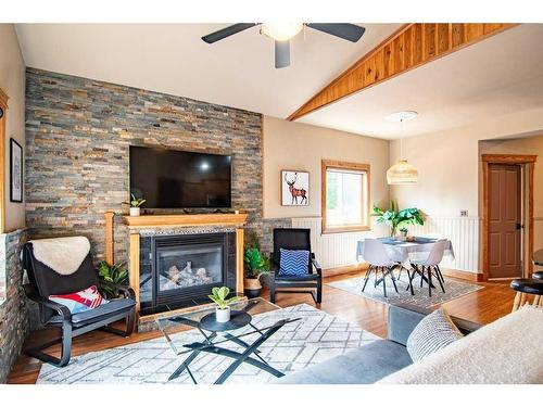 3911 50 Avenue, Sylvan Lake, AB - Indoor Photo Showing Living Room With Fireplace