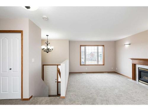 54 Herder Drive, Sylvan Lake, AB - Indoor With Fireplace