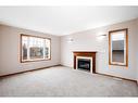 54 Herder Drive, Sylvan Lake, AB  - Indoor Photo Showing Living Room With Fireplace 