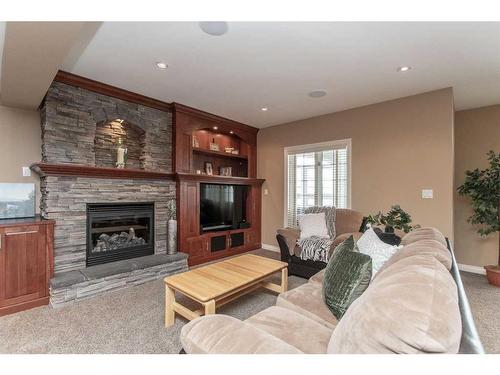 217-27111 Highway 597, Rural Lacombe County, AB - Indoor Photo Showing Living Room With Fireplace