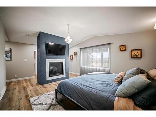 3801 50 Street, Camrose, AB - Indoor Photo Showing Bedroom With Fireplace