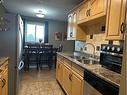 301-4722 44 Street, Sylvan Lake, AB  - Indoor Photo Showing Kitchen With Double Sink 