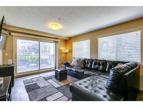 1111-450 Sage Valley Drive Nw, Calgary, AB - Indoor Photo Showing Living Room