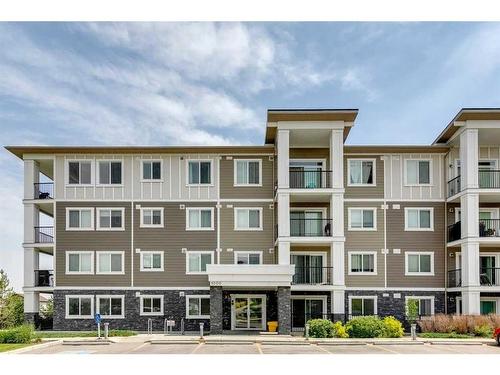 1111-450 Sage Valley Drive Nw, Calgary, AB - Outdoor With Balcony With Facade