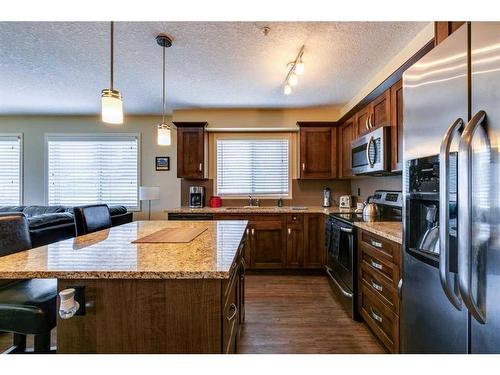 1111-450 Sage Valley Drive Nw, Calgary, AB - Indoor Photo Showing Kitchen With Double Sink