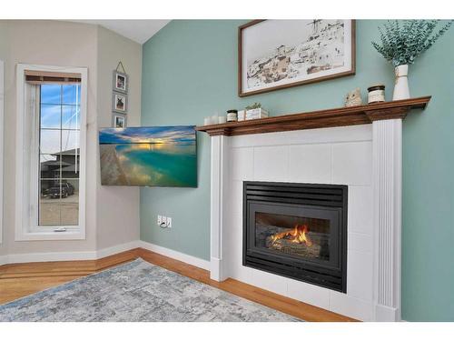 8 Pritchard Close, Sylvan Lake, AB - Indoor Photo Showing Living Room With Fireplace