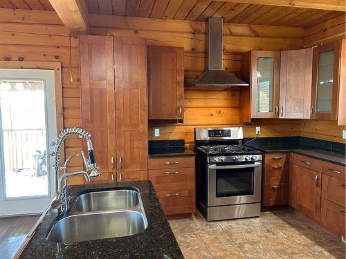 516 Pintail Drive, Pelican Point, AB - Indoor Photo Showing Kitchen With Double Sink