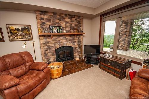 37473 Range Road 223, Rural Red Deer County, AB - Indoor Photo Showing Living Room With Fireplace