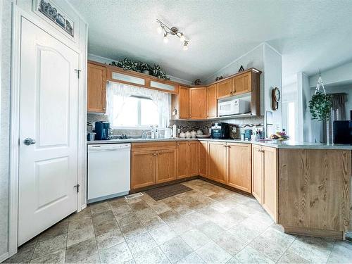 6013 53 Avenue Close, Stettler, AB - Indoor Photo Showing Kitchen With Double Sink