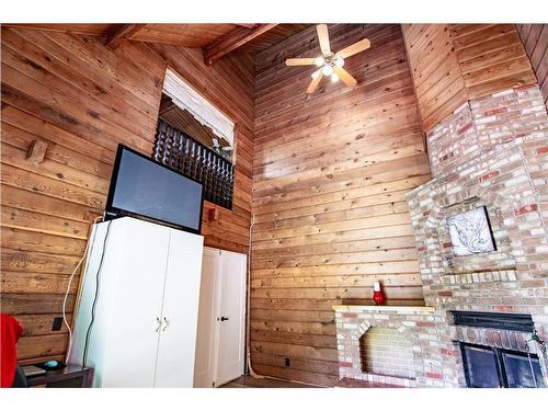 205 Wedgewood, Rural Red Deer County, AB - Indoor Photo Showing Other Room With Fireplace