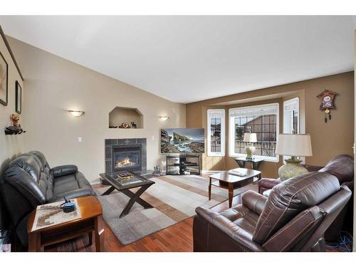 5329 Drader Crescent, Rimbey, AB - Indoor Photo Showing Living Room With Fireplace