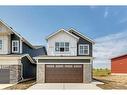 62 Larkspur Bend, Okotoks, AB  - Outdoor With Facade 