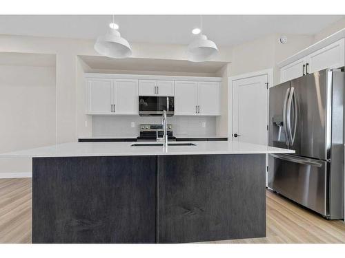 23 Gray Close, Sylvan Lake, AB - Indoor Photo Showing Kitchen With Upgraded Kitchen