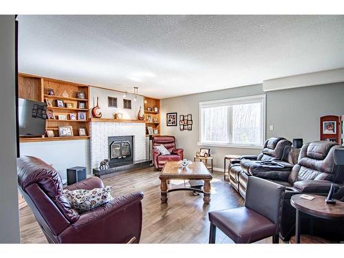 7 Tragondale Cove, Rural Clearwater County, AB - Indoor Photo Showing Living Room With Fireplace