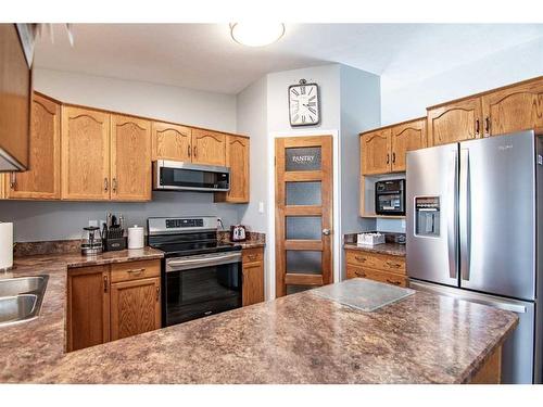 7 Tragondale Cove, Rural Clearwater County, AB - Indoor Photo Showing Kitchen With Double Sink