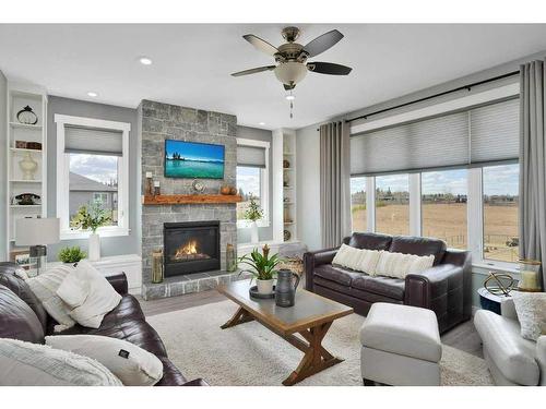 9-420060 Range Road 261, Rural Ponoka County, AB - Indoor Photo Showing Living Room With Fireplace