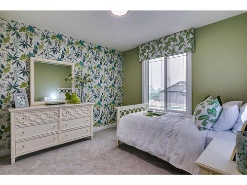 932 Langholm Drive Se, Airdrie, AB - Indoor Photo Showing Bedroom