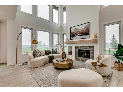 932 Langholm Drive Se, Airdrie, AB - Indoor Photo Showing Living Room With Fireplace
