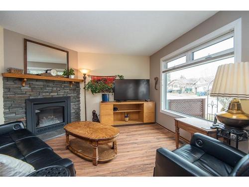 4621 44 Street, Red Deer, AB - Indoor Photo Showing Living Room With Fireplace