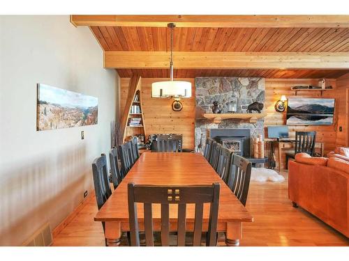 95 Grand Avenue, Norglenwold, AB - Indoor Photo Showing Dining Room With Fireplace