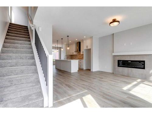 57 Royal Elm Green Nw, Calgary, AB - Indoor With Fireplace