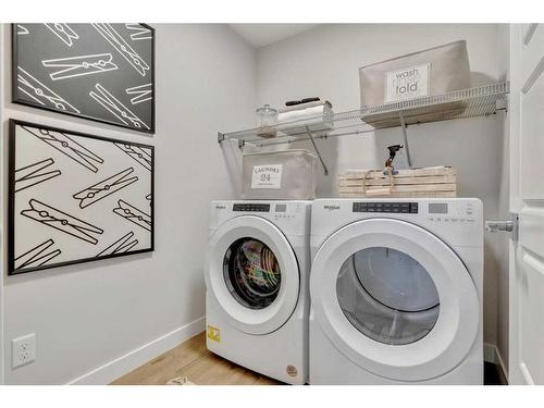 67 Versant View Sw, Calgary, AB - Indoor Photo Showing Laundry Room