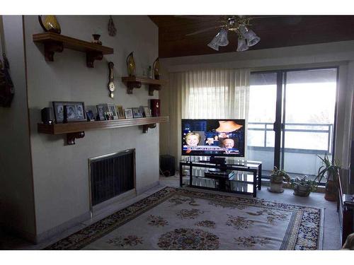 407-3719C 49 Street Nw, Calgary, AB - Indoor With Fireplace