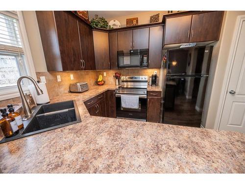 93 Piper Close, Blackfalds, AB - Indoor Photo Showing Kitchen With Double Sink