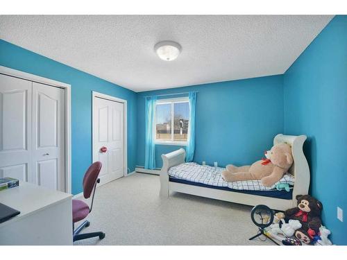 103-4904 54 Street, Red Deer, AB - Indoor Photo Showing Bedroom