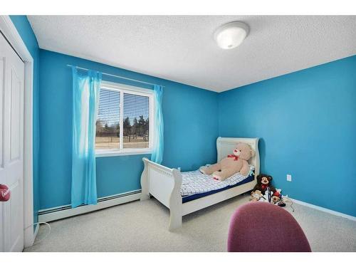 103-4904 54 Street, Red Deer, AB - Indoor Photo Showing Bedroom