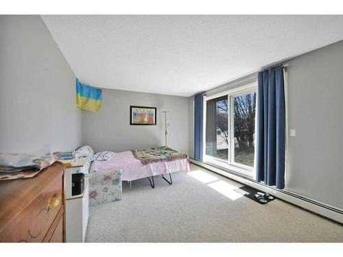 103-4904 54 Street, Red Deer, AB - Indoor Photo Showing Bedroom