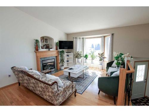 7 Fern Glade Crescent, Sylvan Lake, AB - Indoor Photo Showing Living Room With Fireplace