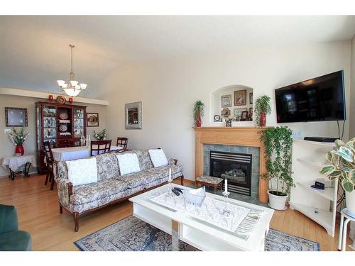 7 Fern Glade Crescent, Sylvan Lake, AB - Indoor Photo Showing Living Room With Fireplace