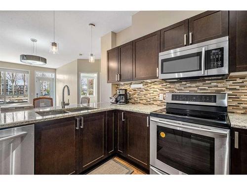 104-4303 1 Street Ne, Calgary, AB - Indoor Photo Showing Kitchen With Double Sink With Upgraded Kitchen