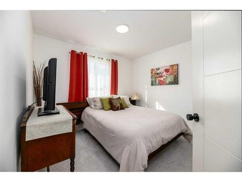 50 Iron Gate Boulevard, Sylvan Lake, AB - Indoor Photo Showing Bedroom