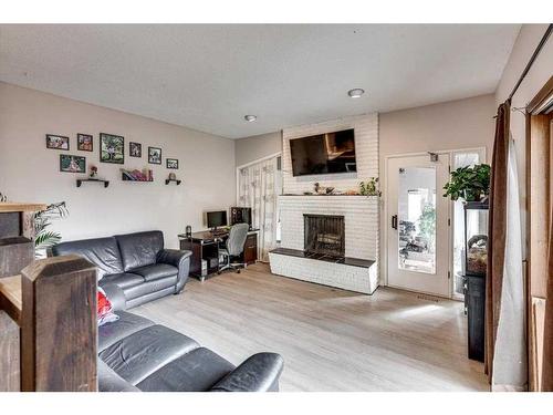 35 Odell Green, Red Deer, AB - Indoor Photo Showing Living Room With Fireplace