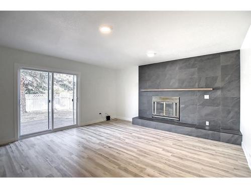 65 Gilbert Crescent, Red Deer, AB - Indoor With Fireplace