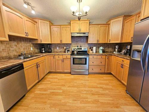 108-600 6 Street Street Sw, Slave Lake, AB - Indoor Photo Showing Kitchen With Double Sink